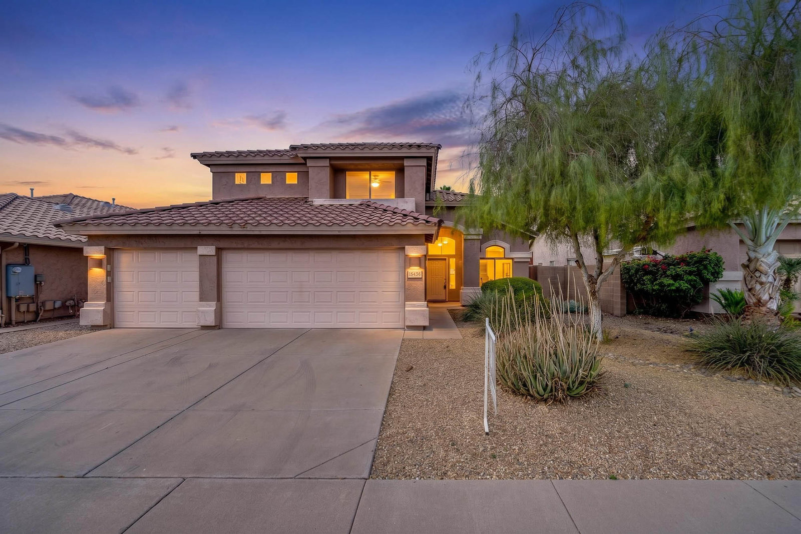 House at twilight with illuminated windows, Chandler, AZ
