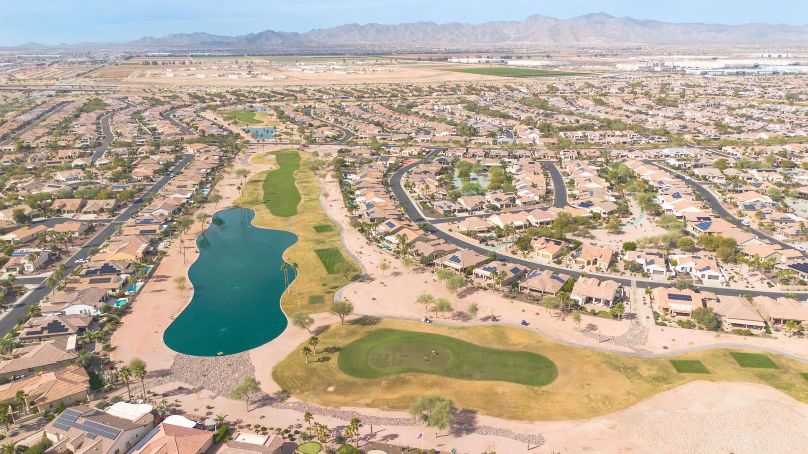 Aerial golf course lake residential real estate photography Goodyear AZ | The Listing Bees