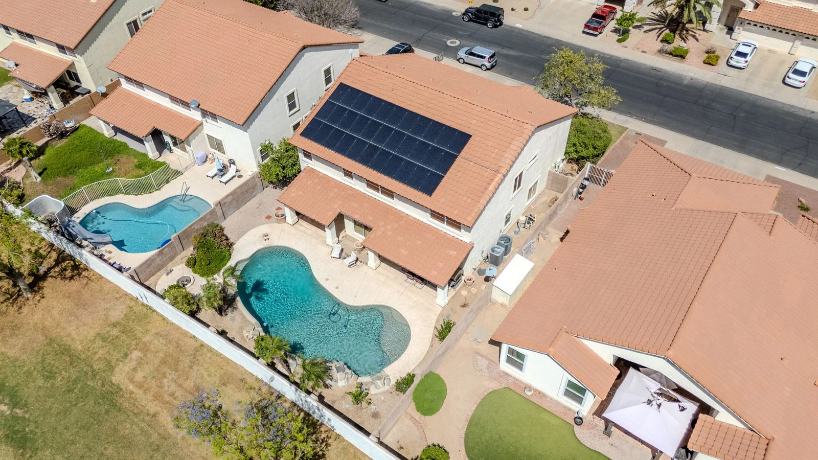 Aerial view houses pools solar panels real estate photography Glendale AZ | The Listing Bees