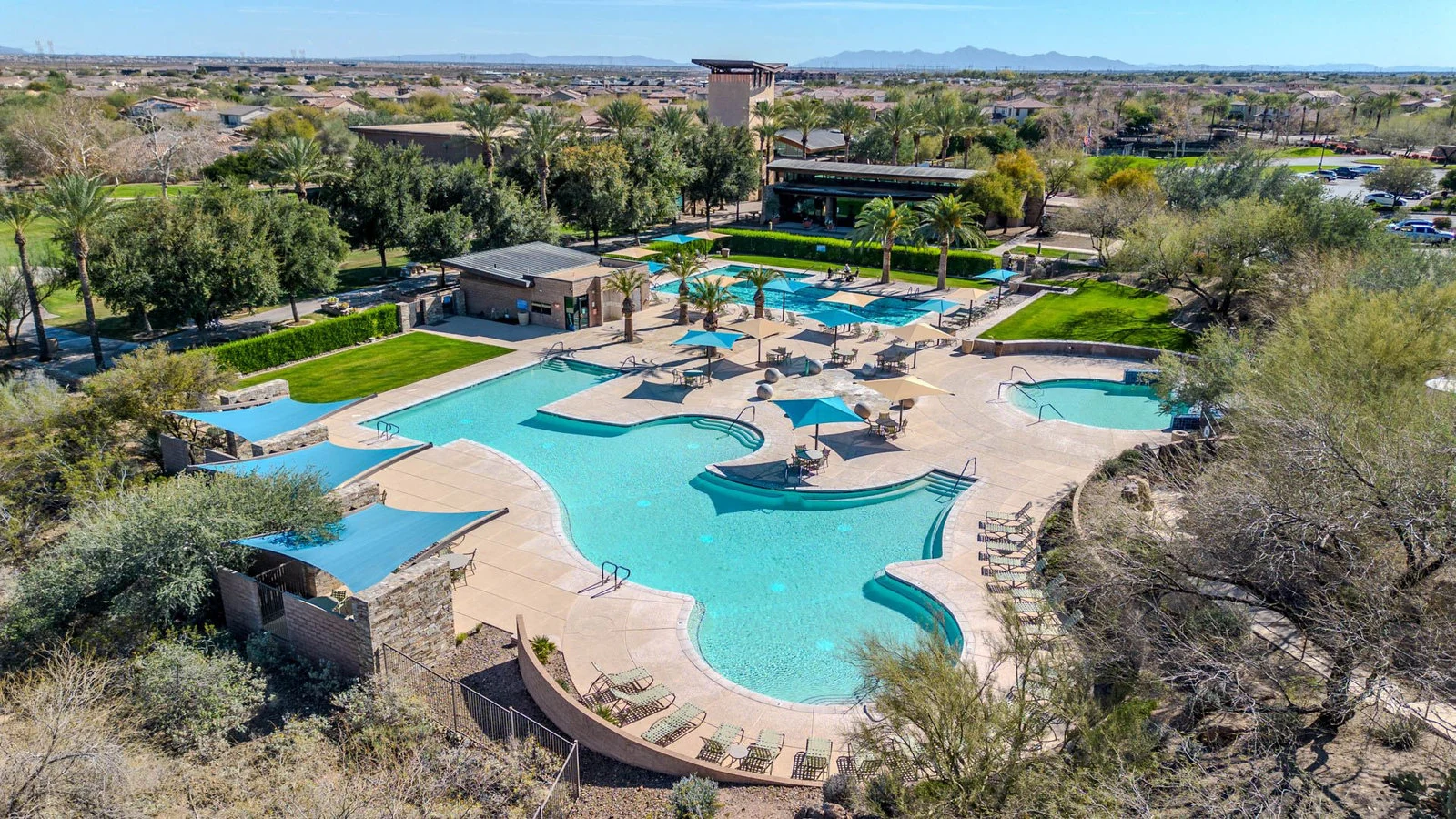 Aerial view large resort swimming pool lounge chairs real estate photography Peoria AZ | The Listing Bees