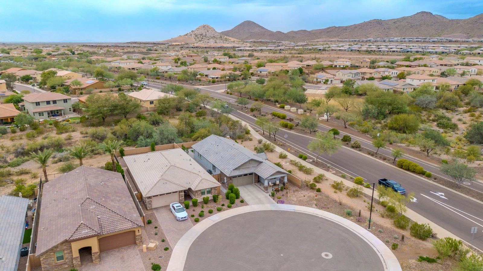 Aerial view of a Peoria neighborhood with mountains