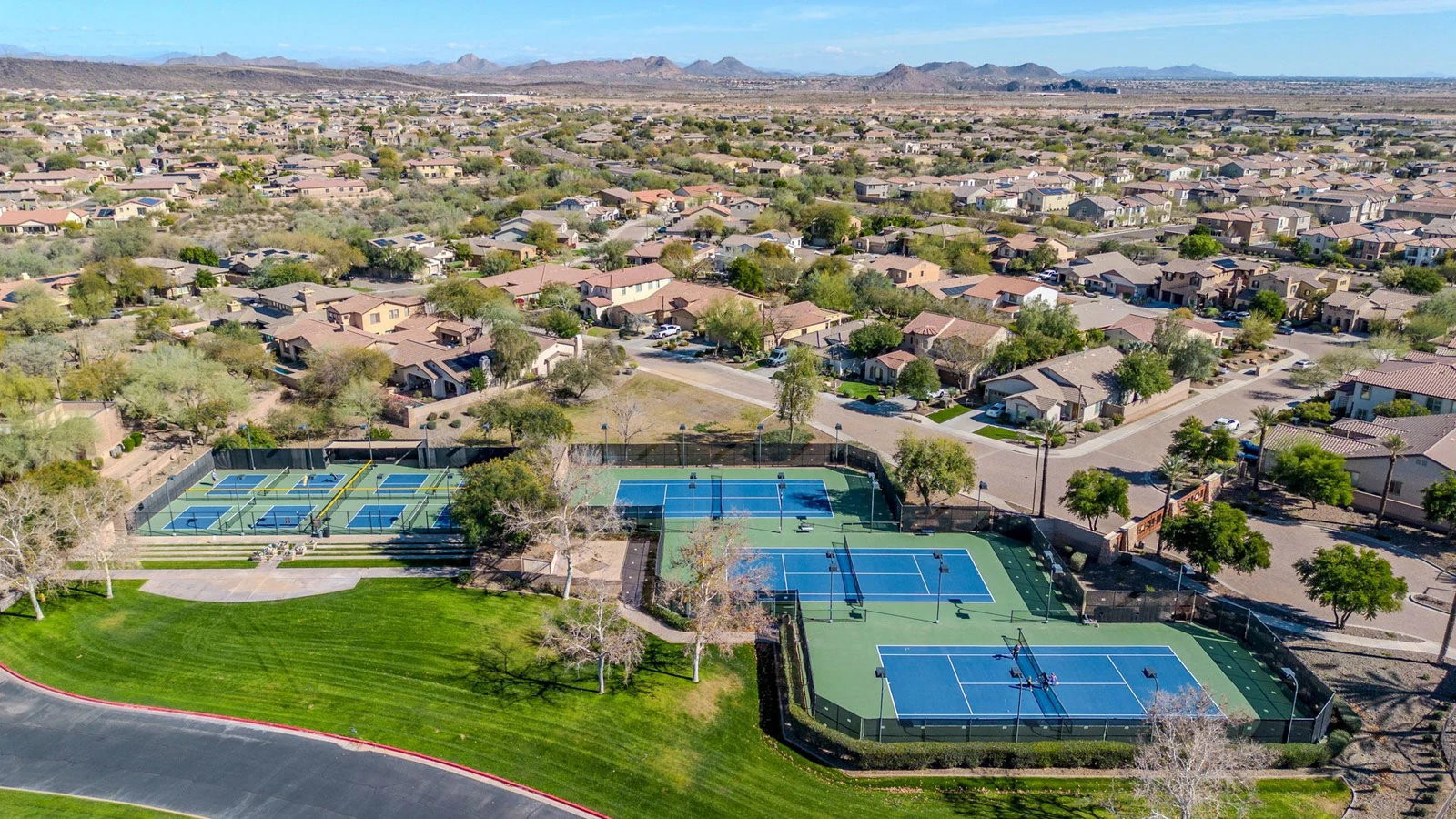 Aerial view residential area blue green tennis courts real estate photography Peoria AZ | The Listing Bees