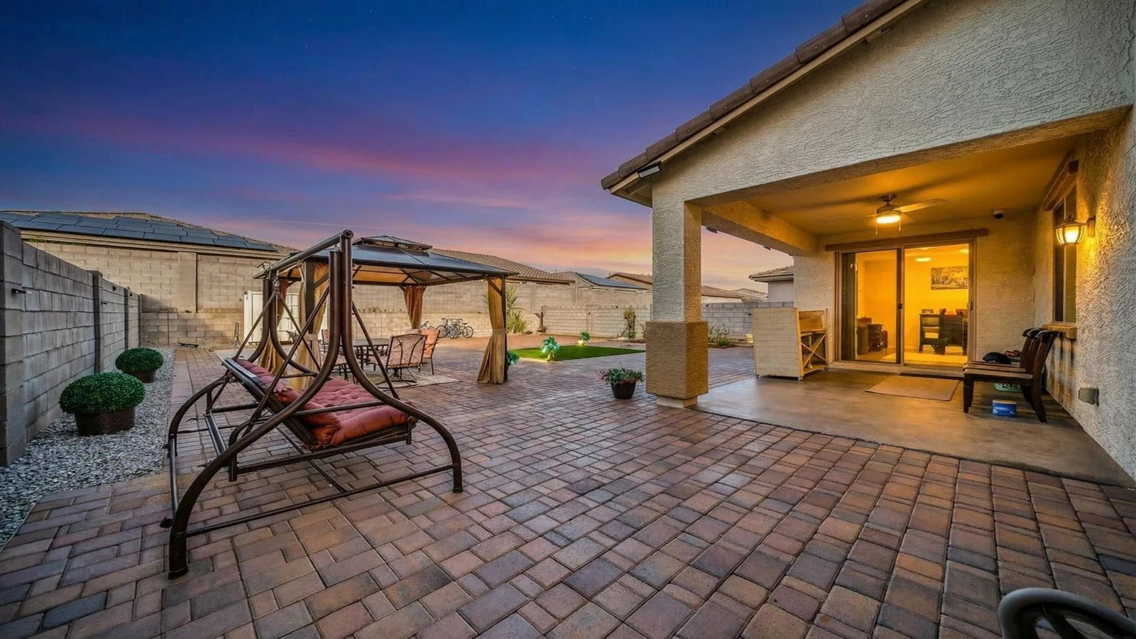 Backyard patio swing covered dining dusk real estate photography Goodyear AZ | The Listing Bees