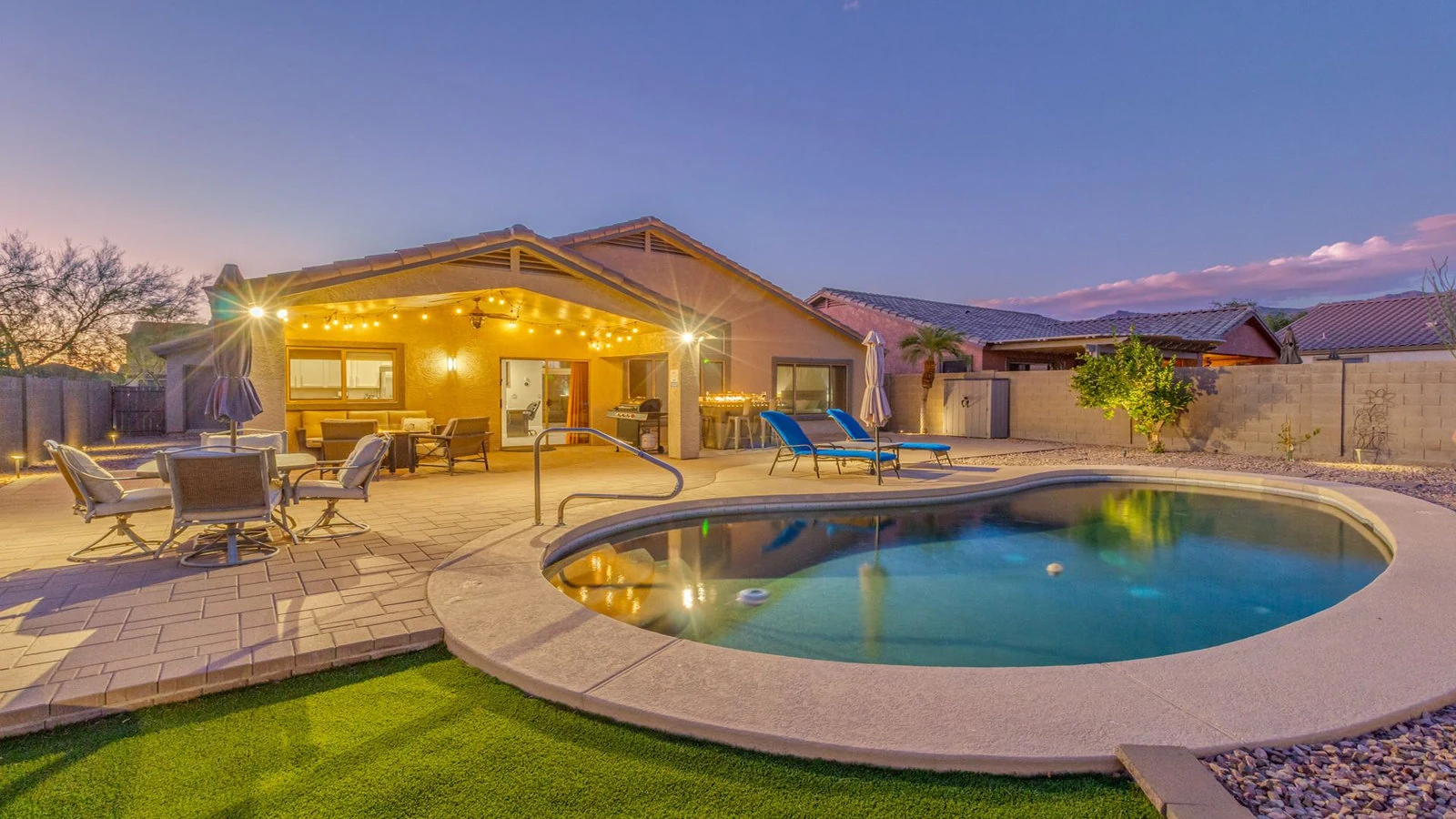 Backyard pool area lighted patio dusk real estate photography Gold Canyon AZ | The Listing Bees