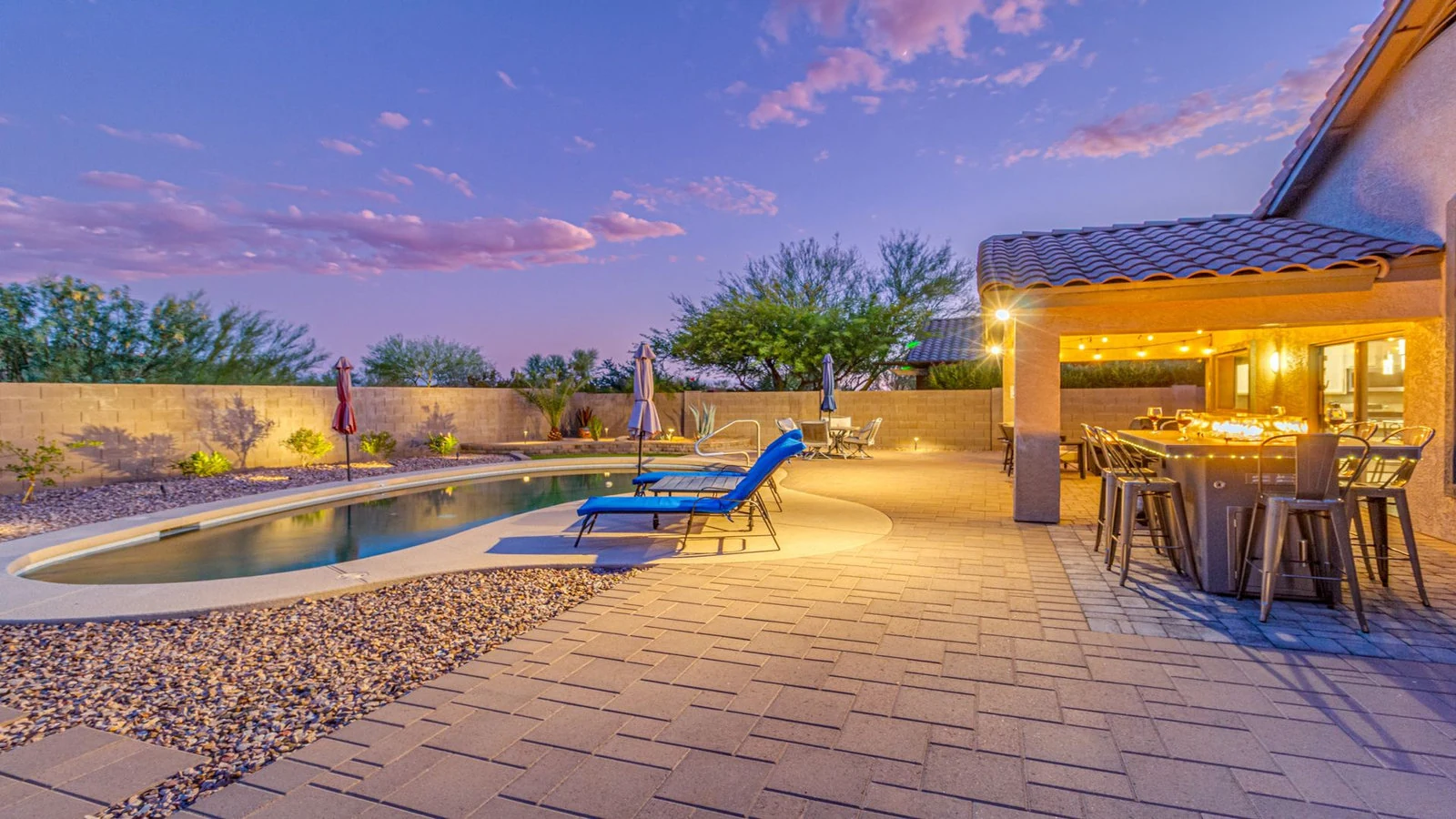Backyard pool lit patio dusk real estate photography Gold Canyon AZ | The Listing Bees