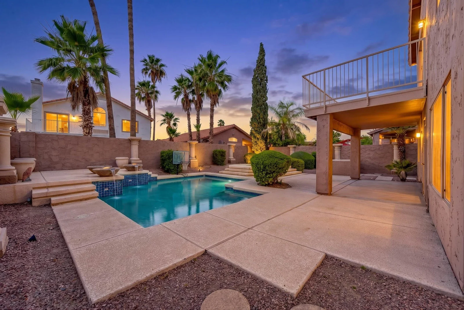 Backyard pool and palms at twilight, Chandler