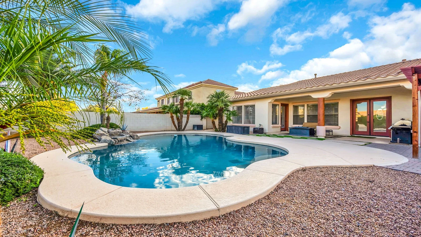 Backyard swimming pool palm trees house real estate photography Queen Creek AZ | The Listing Bees
