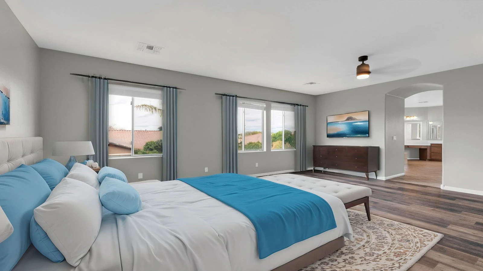 Bedroom blue bed large windows wood floor real estate photography Queen Creek AZ | The Listing Bees