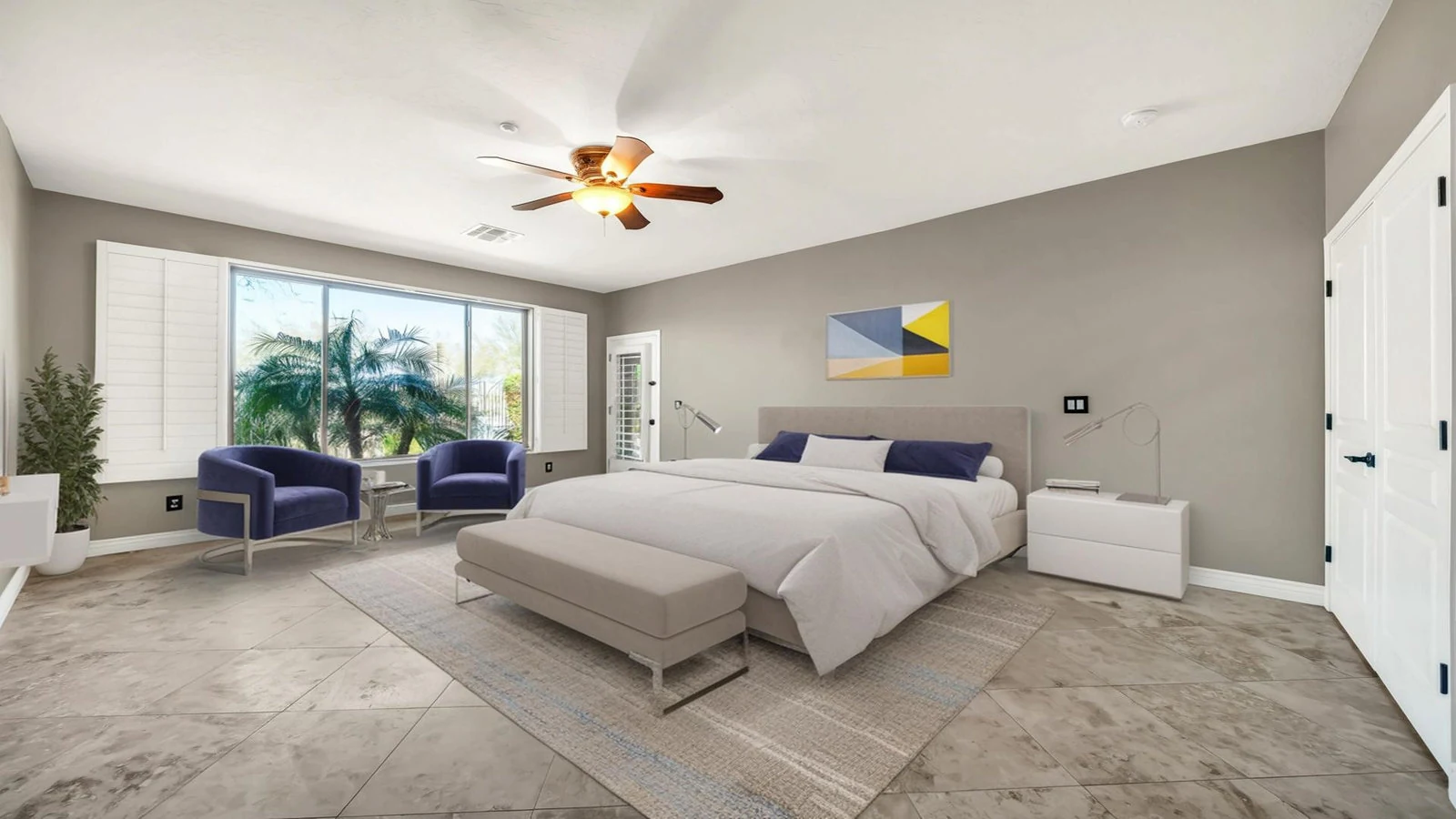 Bedroom large bed blue chairs palm trees real estate photography Anthem AZ | The Listing Bees