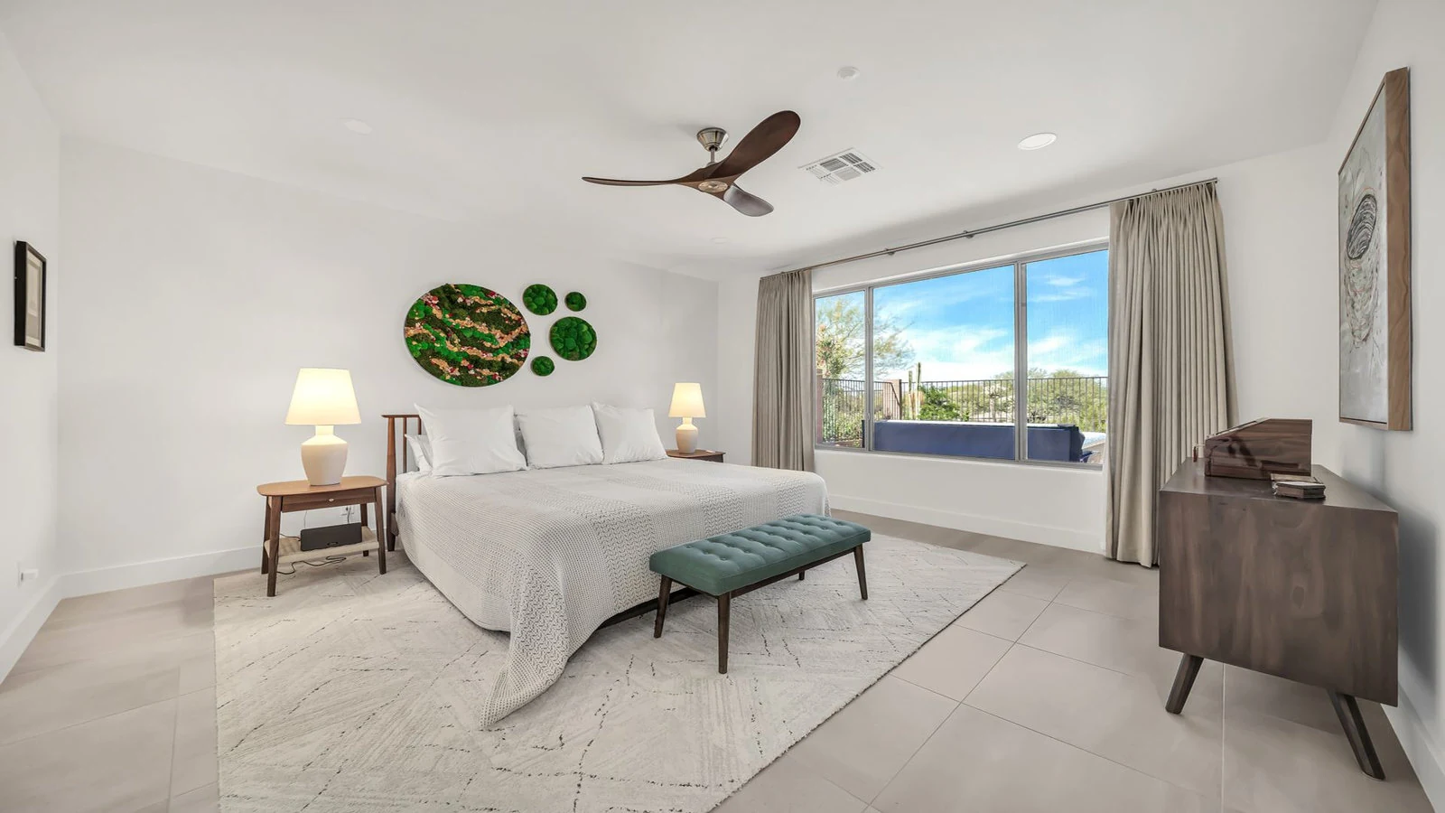 Bedroom white bed ceiling fan large window real estate photography Anthem AZ | The Listing Bees