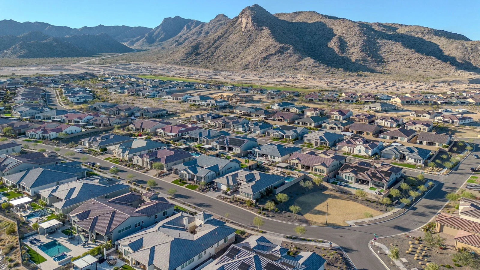 Rooftops against a desert mountain backdrop, Desert Mountain real estate photography, Scottsdale, AZ
