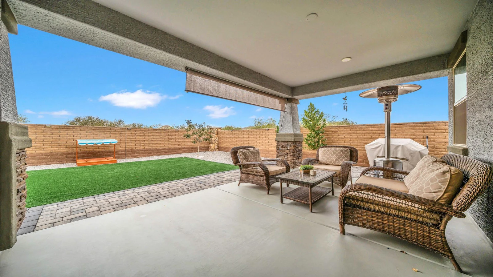 Covered patio outdoor seating turf backyard real estate photography Peoria AZ | The Listing Bees