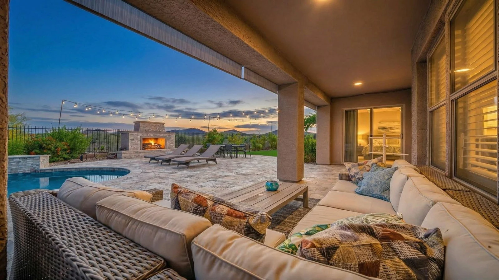 Covered patio pool fireplace sunset mountain view real estate photography Anthem AZ | The Listing Bees