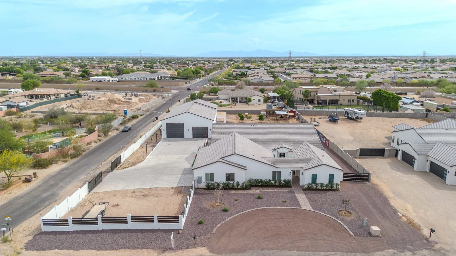 Drone view of a modern house with multiple garages