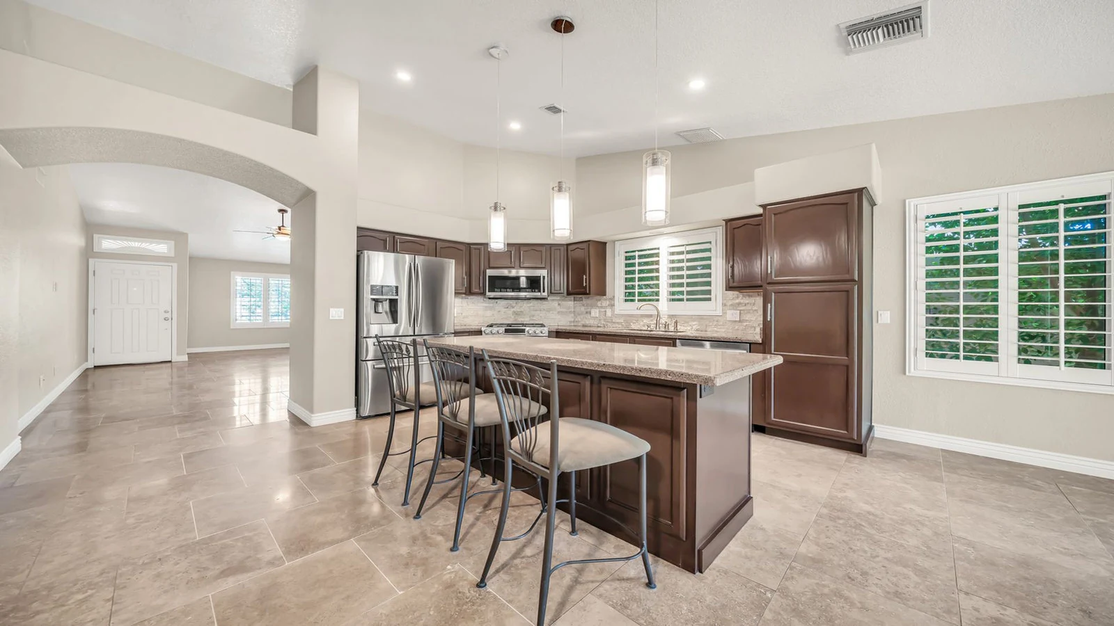 Kitchen dark cabinetry island open living area real estate photography Glendale AZ | The Listing Bees