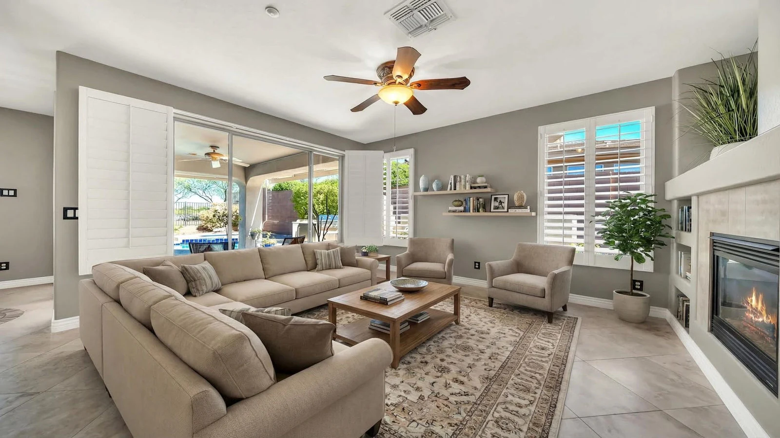 Living room couch chairs fireplace patio view real estate photography Anthem AZ | The Listing Bees