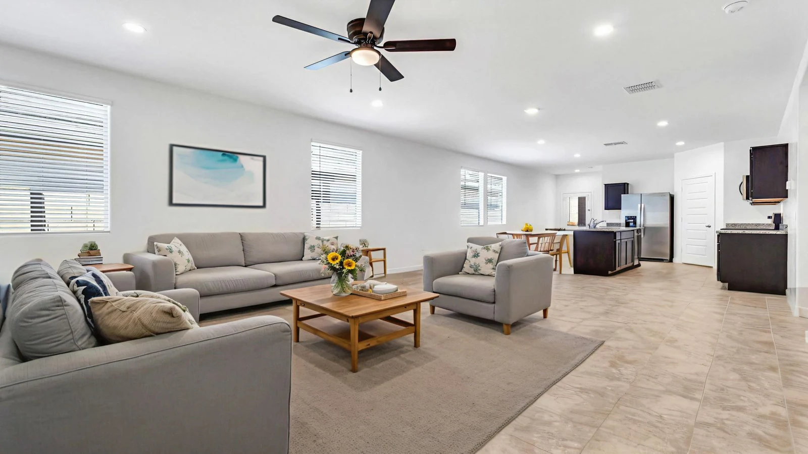 Living room gray sofas open kitchen real estate photography Apache Junction AZ | The Listing Bees