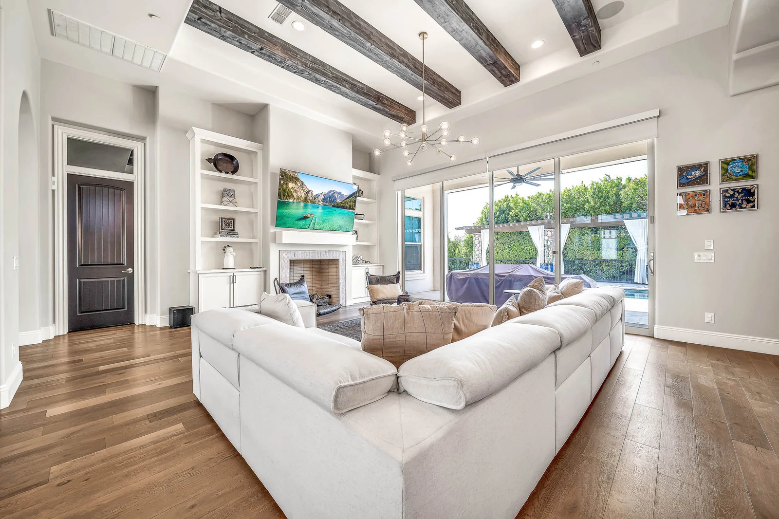 Living room white sofa wood beams patio view real estate photography Cave Creek AZ | The Listing Bees