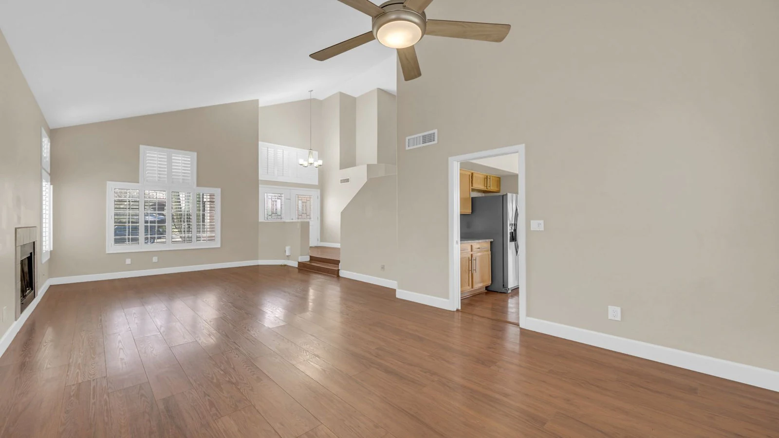 Living room wood floors vaulted ceiling real estate photography Ahwatukee AZ | The Listing Bees