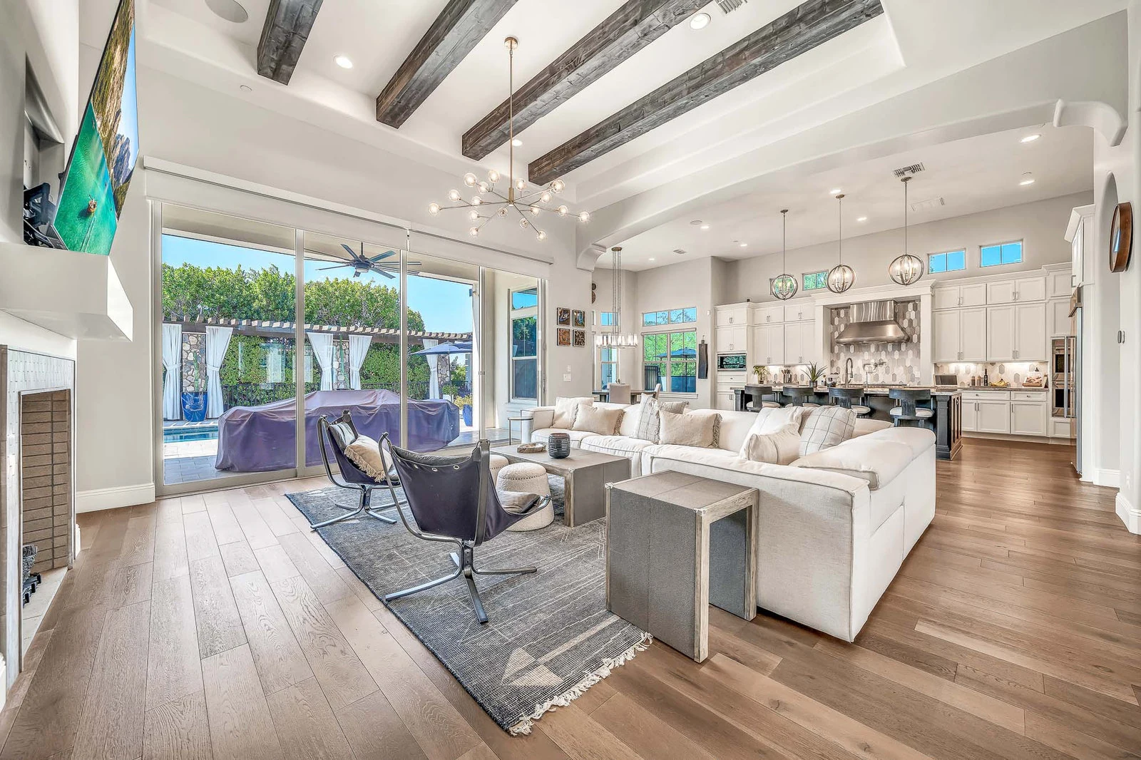 Luxurious great room exposed beams pool view real estate photography Cave Creek AZ | The Listing Bees