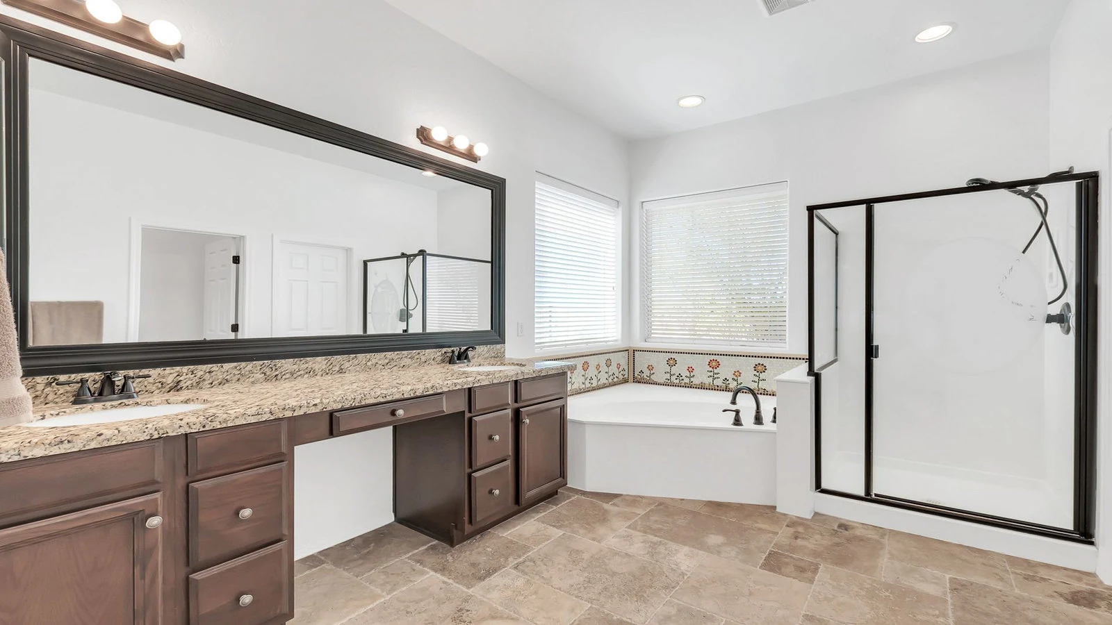 Modern bathroom double vanity corner tub glass shower real estate photography Gold Canyon AZ | The Listing Bees