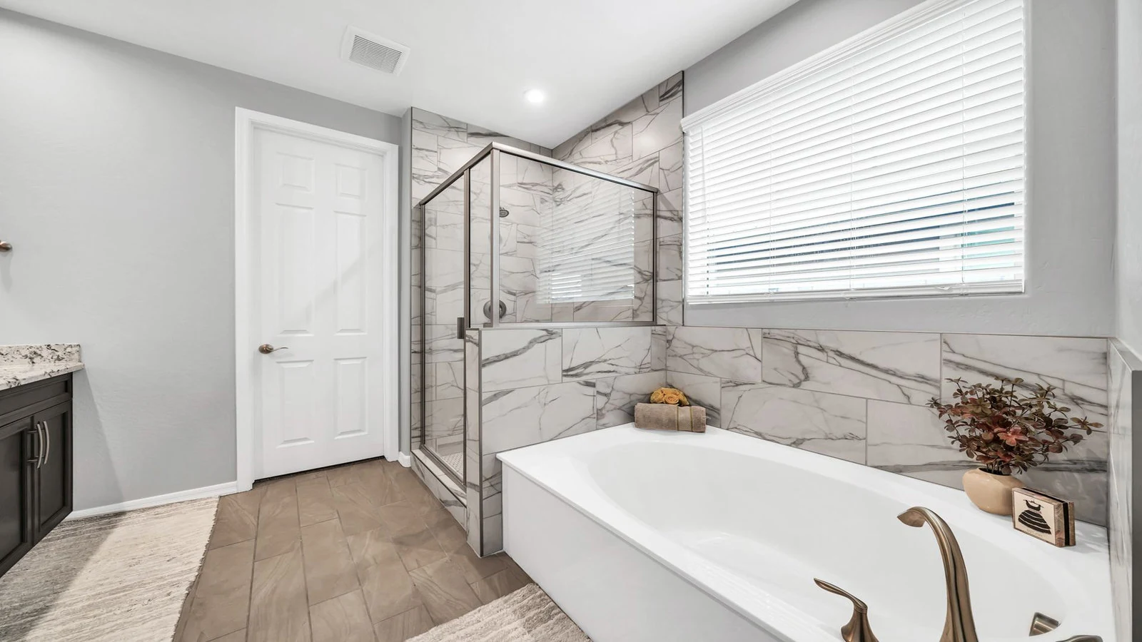 Modern bathroom white tub marble shower real estate photography Peoria AZ | The Listing Bees