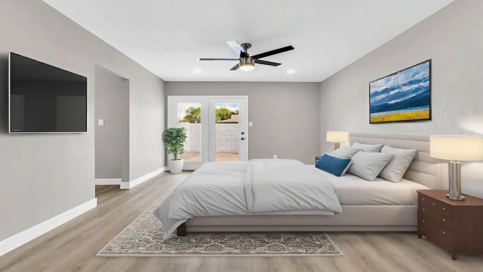 Modern bedroom bed TV French doors patio real estate photography Tempe AZ | The Listing Bees