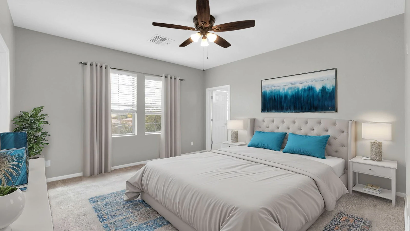 Modern bedroom large bed blue accents real estate photography Queen Creek AZ | The Listing Bees