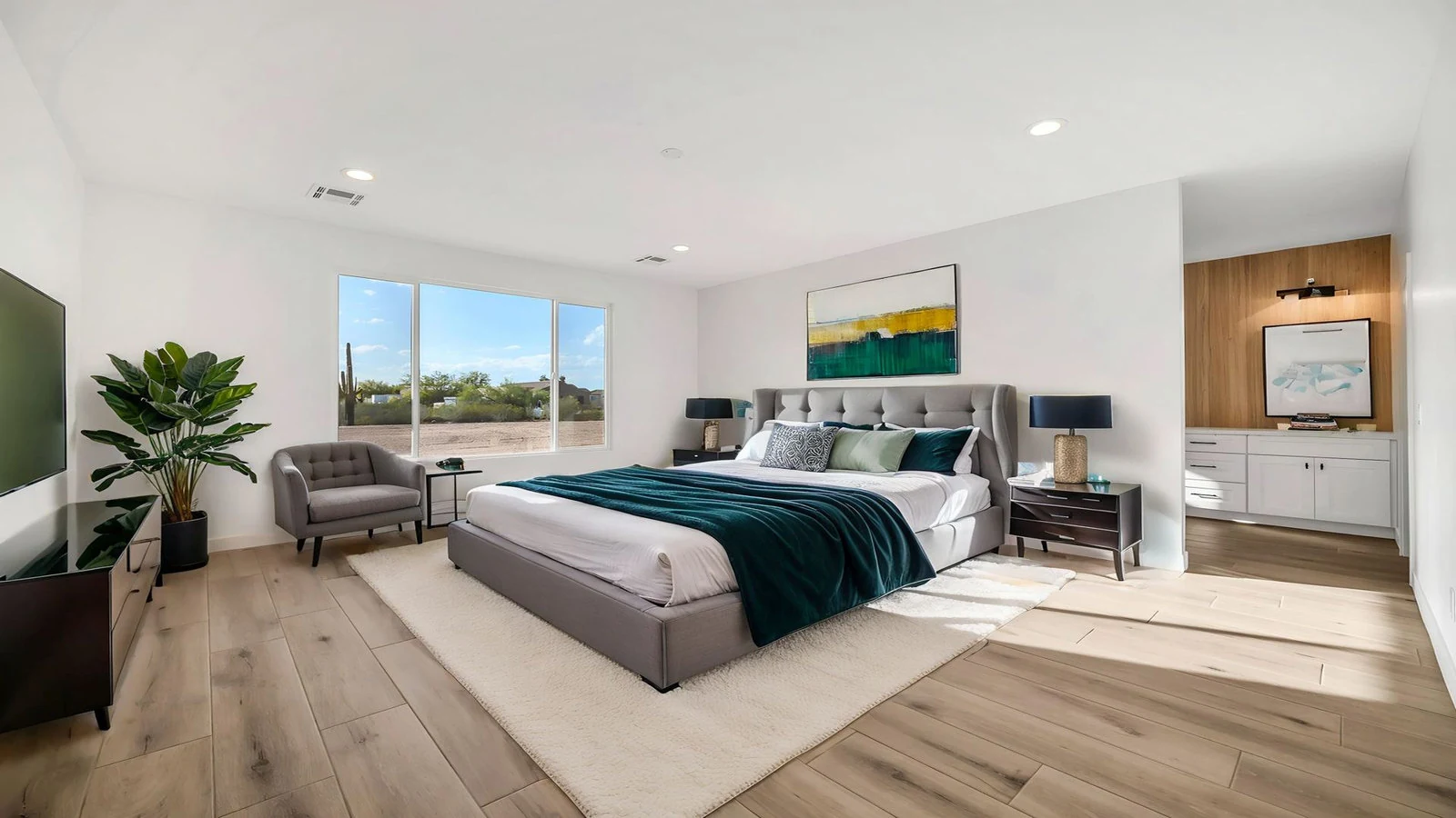 Modern bedroom large bed window view wood floor real estate photography Surprise AZ | The Listing Bees