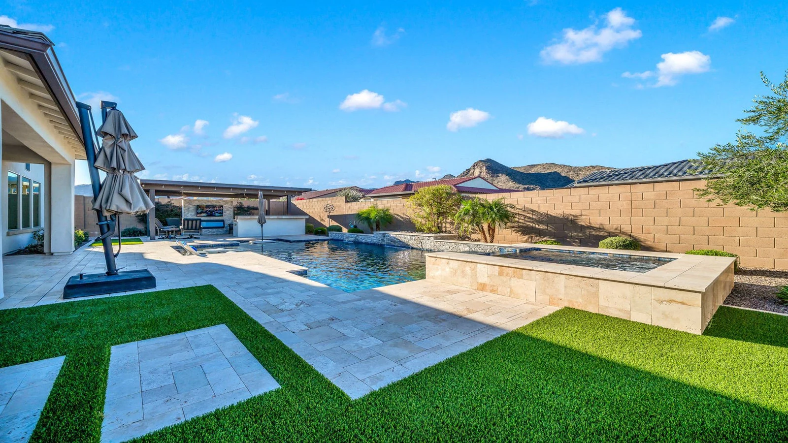 Modern backyard with a pool and spa in Verrado, Buckeye, AZ