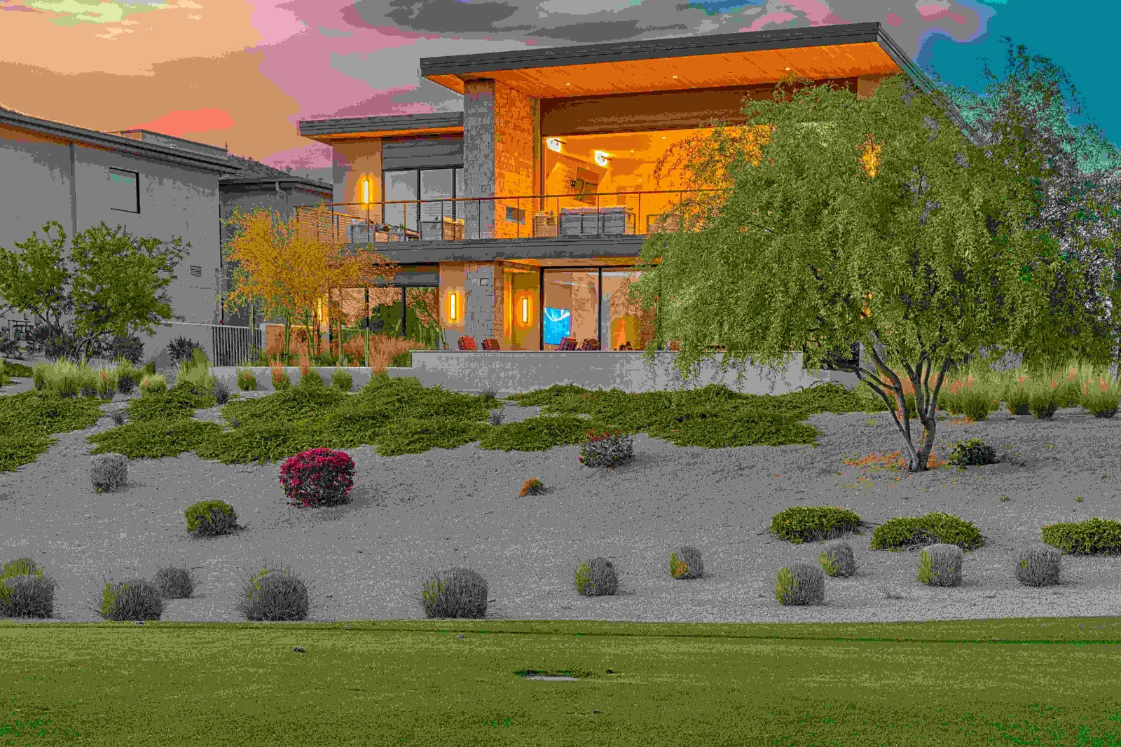 Modern house exterior, lit up at twilight