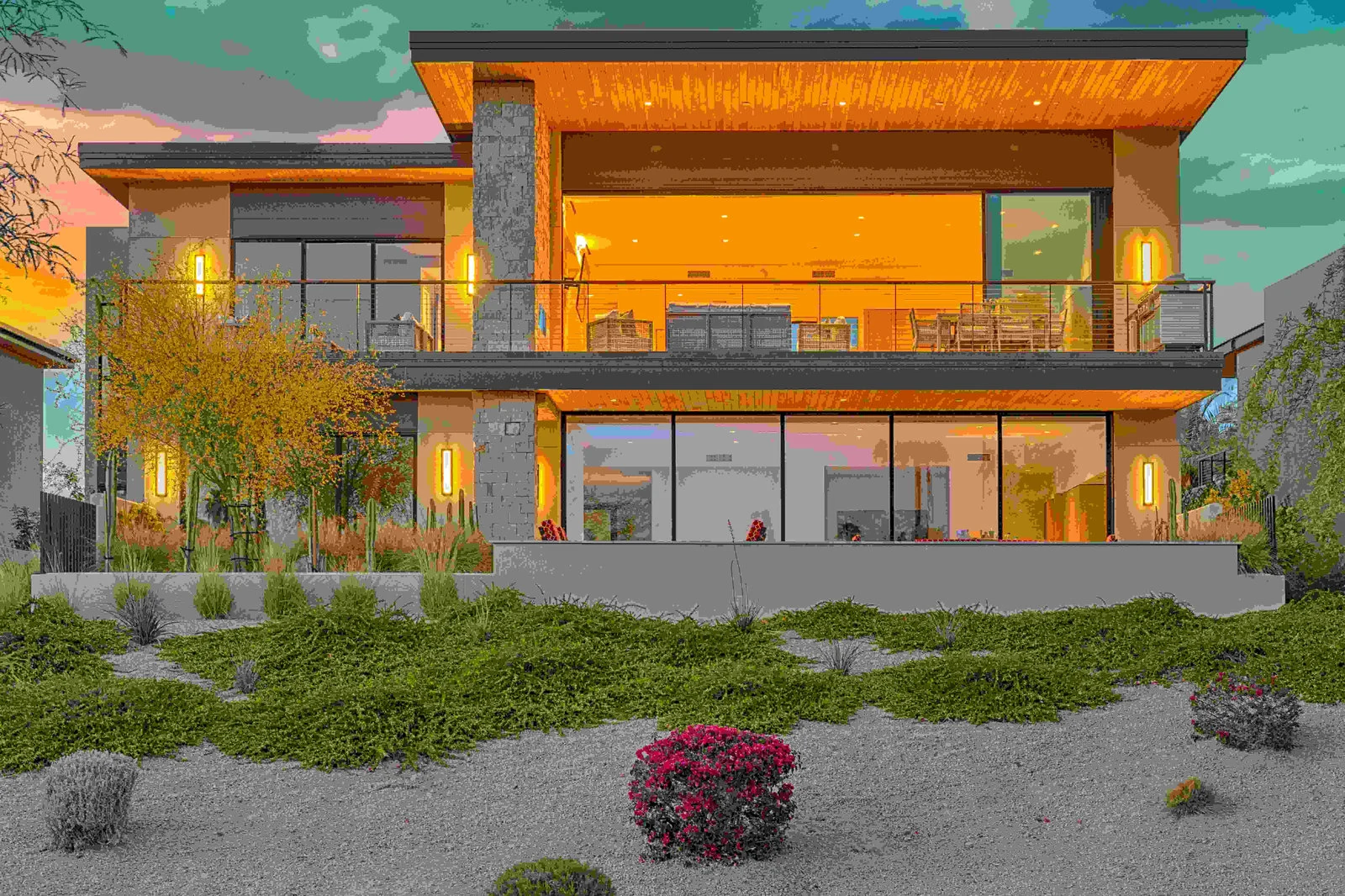 Modern house with illuminated interior at twilight