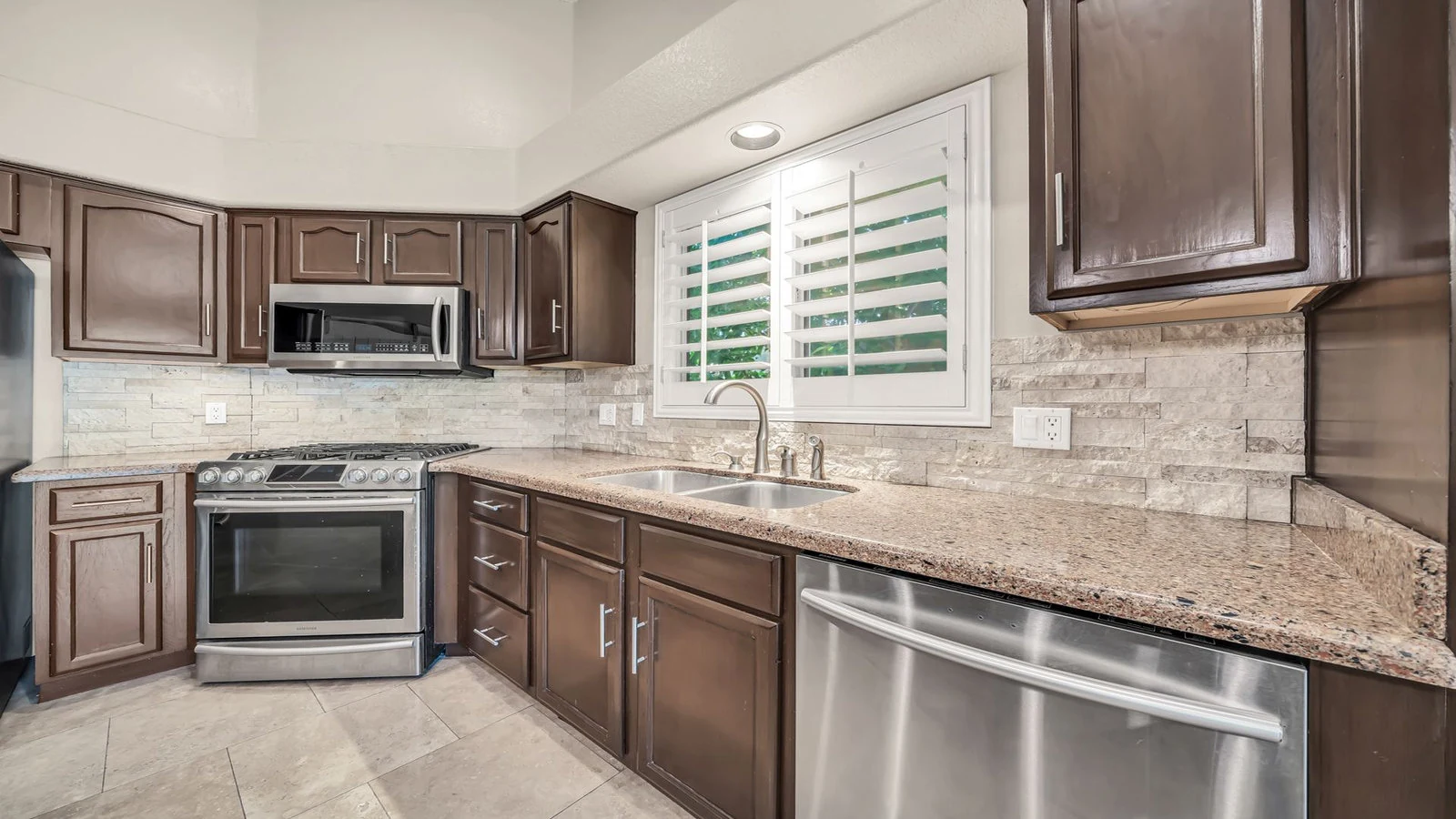 Modern kitchen dark cabinets stainless steel appliances real estate photography Glendale AZ | The Listing Bees