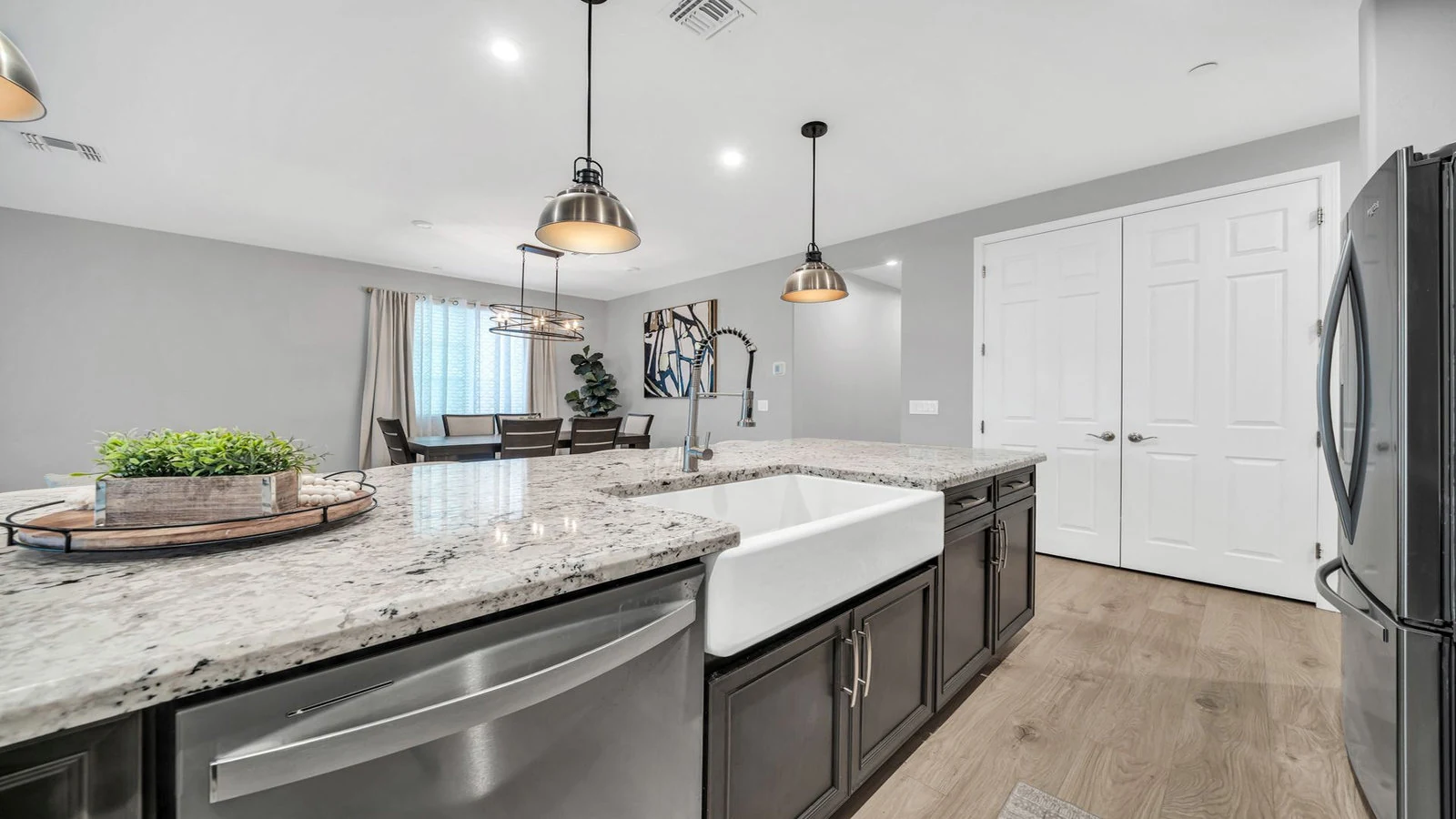 Modern kitchen large island farm sink dining area real estate photography Peoria AZ | The Listing Bees