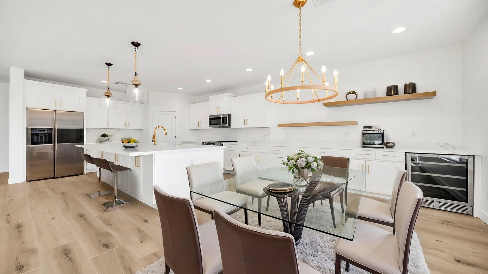 Modern kitchen white cabinets island dining area real estate photography Surprise AZ | The Listing Bees
