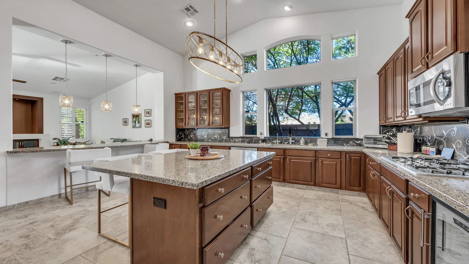 Modern kitchen wood cabinets island large window real estate photography Tempe AZ | The Listing Bees