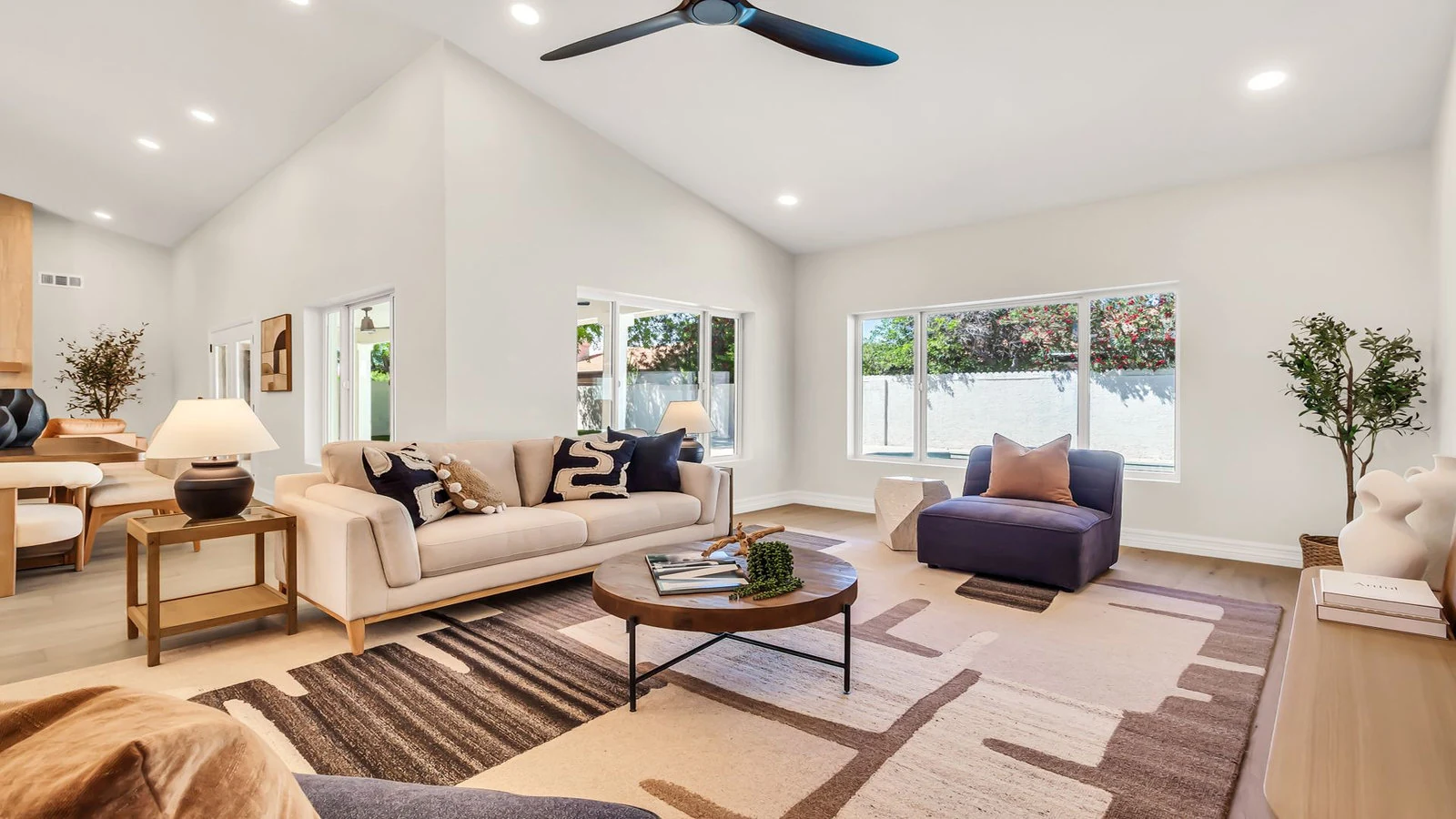 Modern living room vaulted ceiling sofa armchair real estate photography Tempe AZ | The Listing Bees
