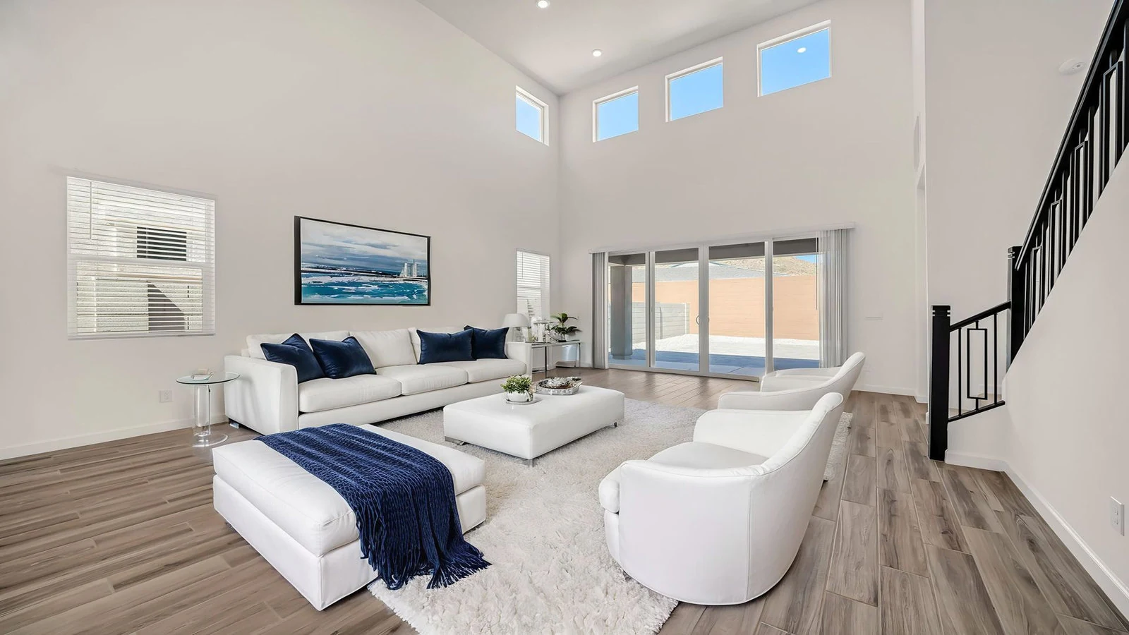Modern living room white sofa chairs high ceilings real estate photography Peoria AZ | The Listing Bees