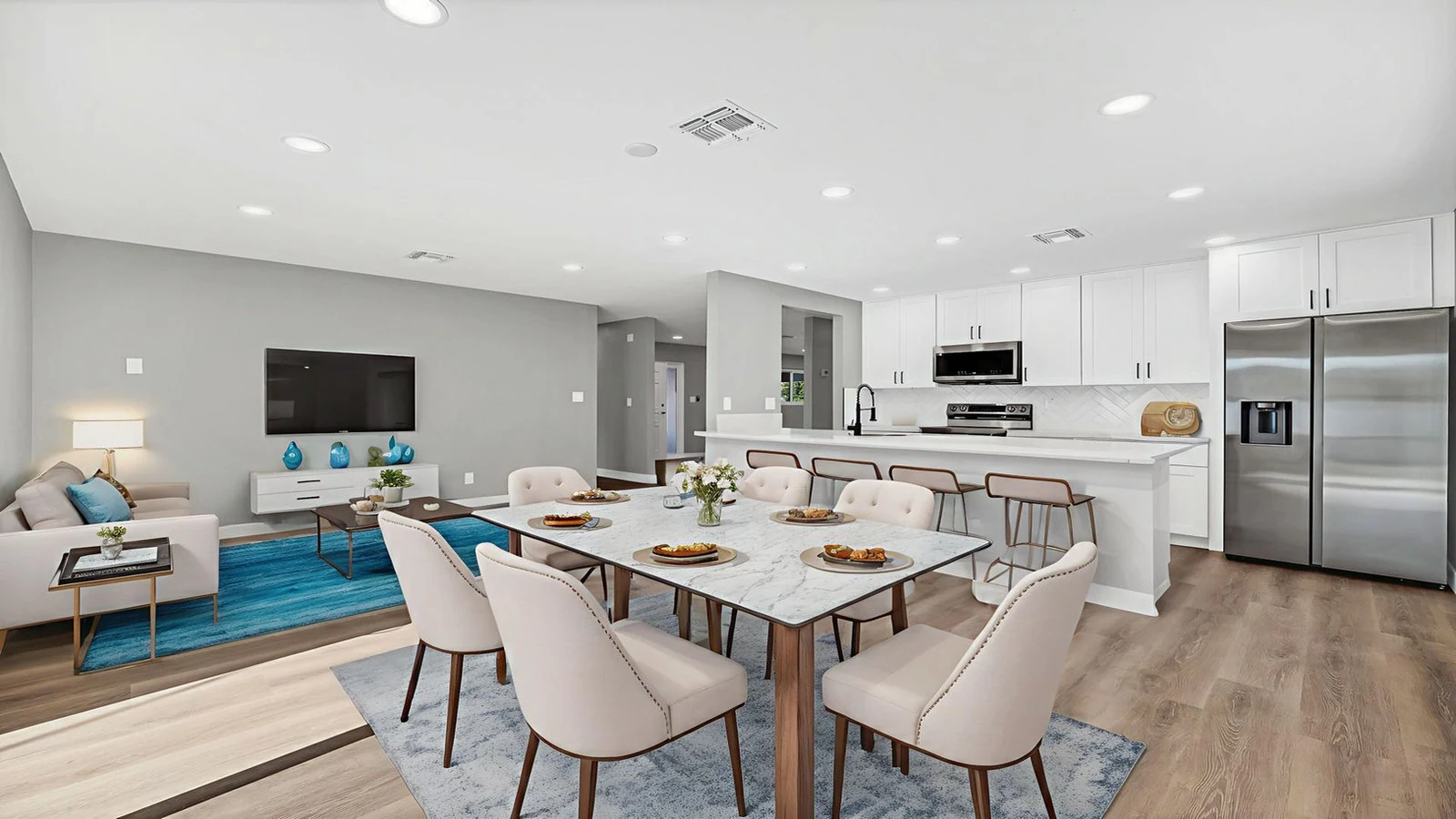 Open concept living room, dining, and kitchen area