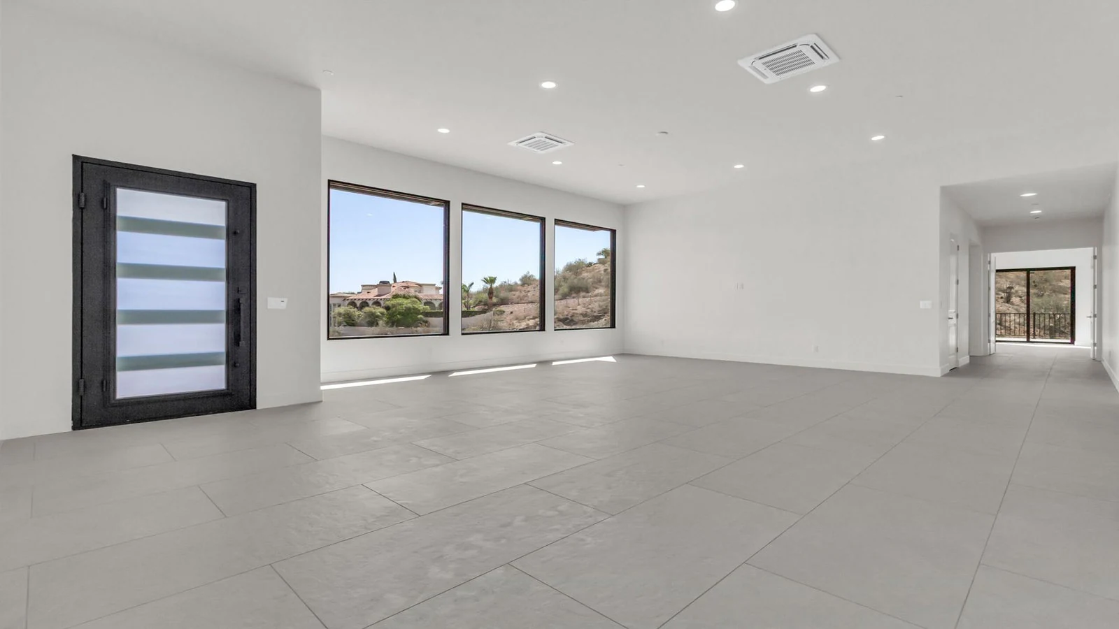 Modern room large windows dark front door real estate photography Fountain Hills AZ | The Listing Bees