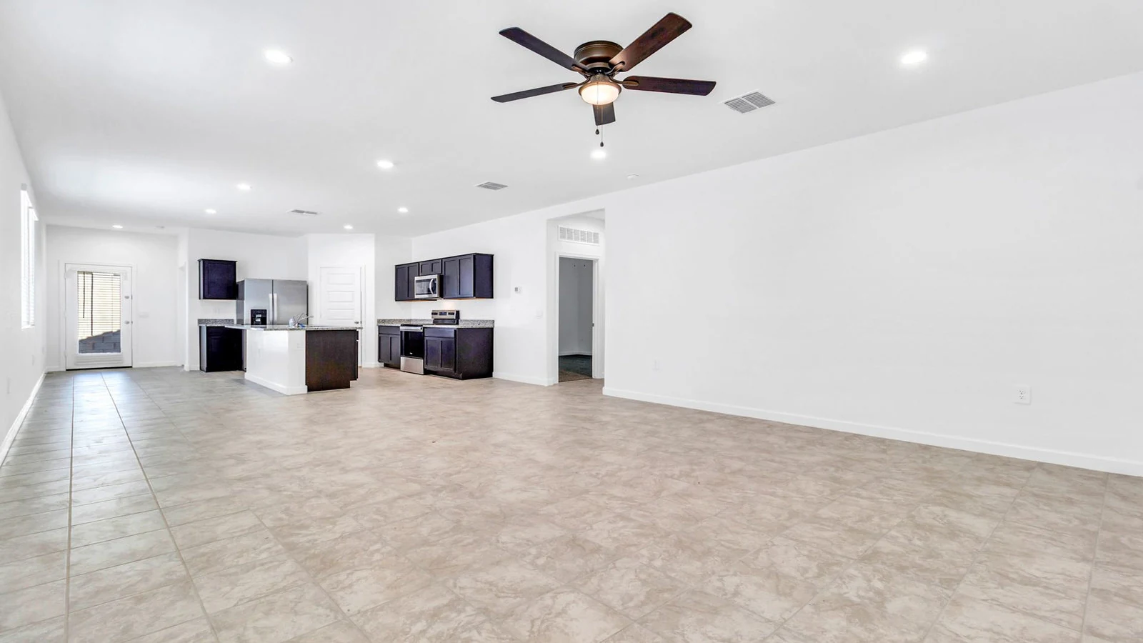 Open concept living room kitchen tile floor real estate photography Apache Junction AZ | The Listing Bees