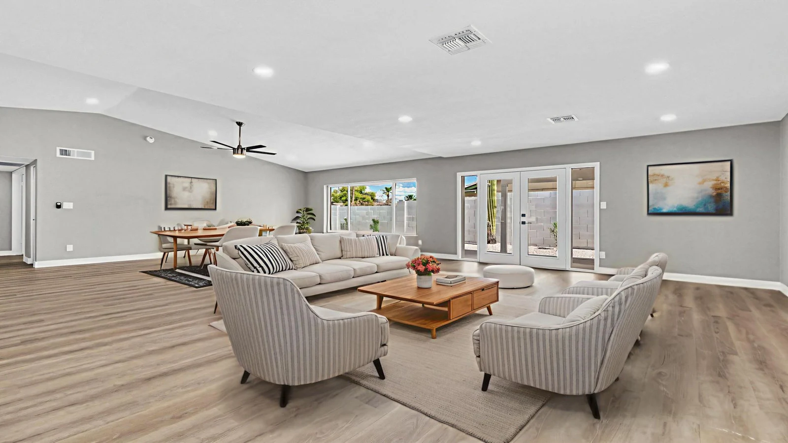 Open-plan living room sofa chairs dining space real estate photography Tempe AZ | The Listing Bees