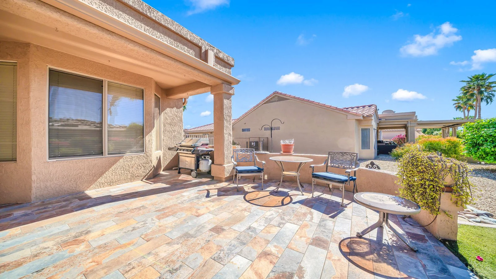 Outdoor patio tiled floor dining set grill real estate photography Surprise AZ | The Listing Bees