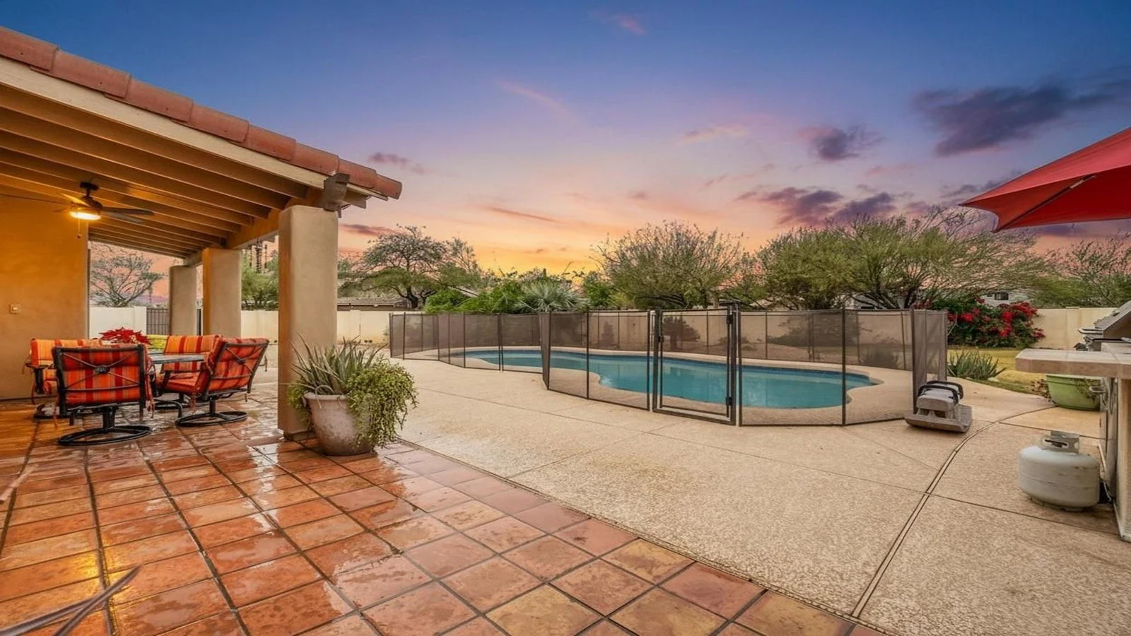 Patio dining area fenced pool sunset real estate photography Peoria AZ | The Listing Bees