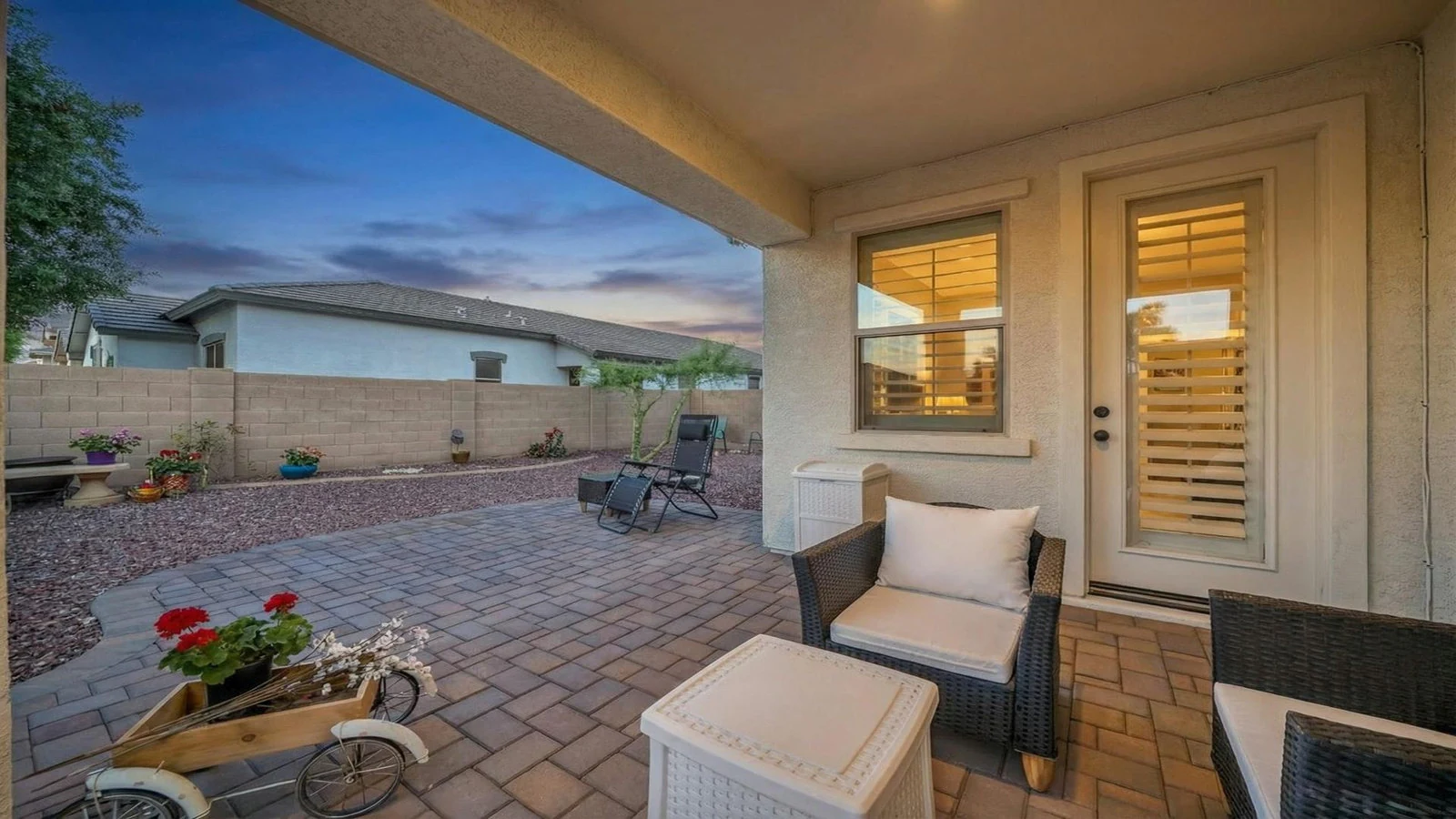 Paved patio outdoor furniture backyard dusk real estate photography Surprise AZ | The Listing Bees