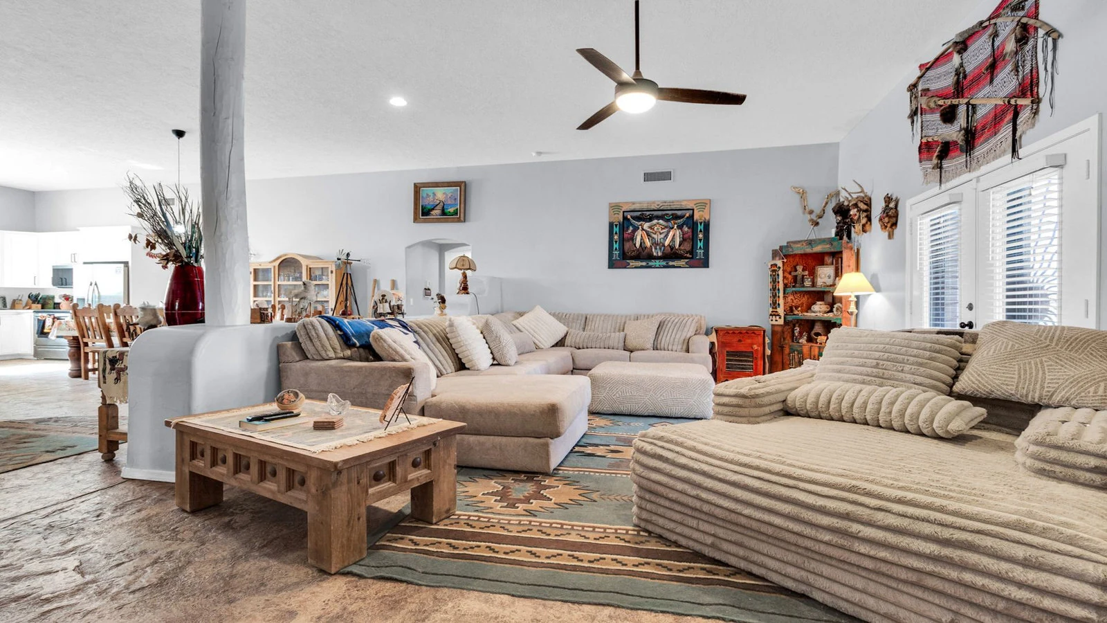 Living room sectional sofa carved wood table real estate photography Apache Junction AZ | The Listing Bees