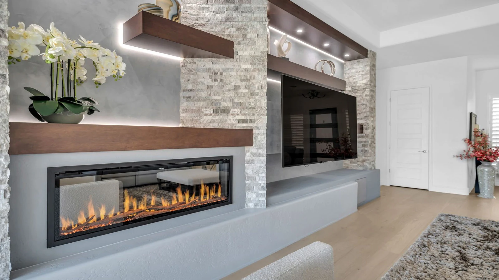 Contemporary living room with linear electric fireplace and TV