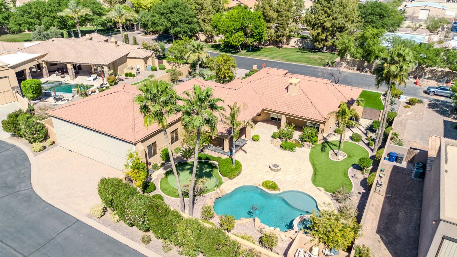 Aerial of a Sun Lakes home with a pool and golf-course frontage in Chandler, AZ