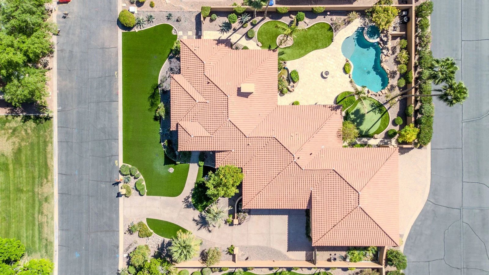 Top-down aerial of a Chandler home with a pool and large lot, photographed for an Ocotillo listing