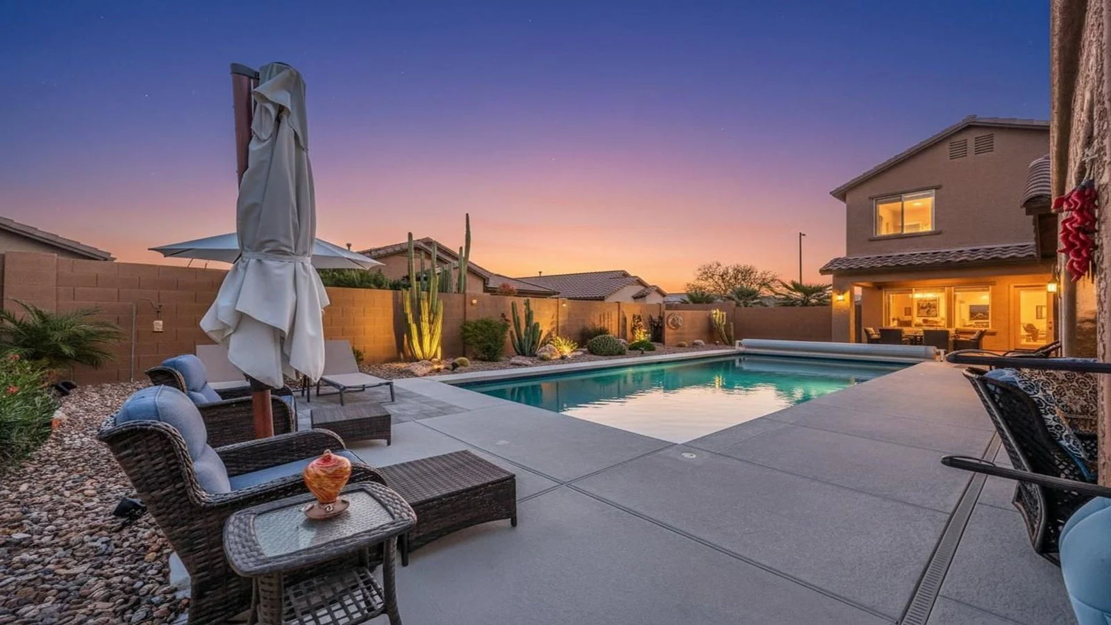 Evening photo of a Chandler backyard pool and patio, photographed for an Ocotillo listing